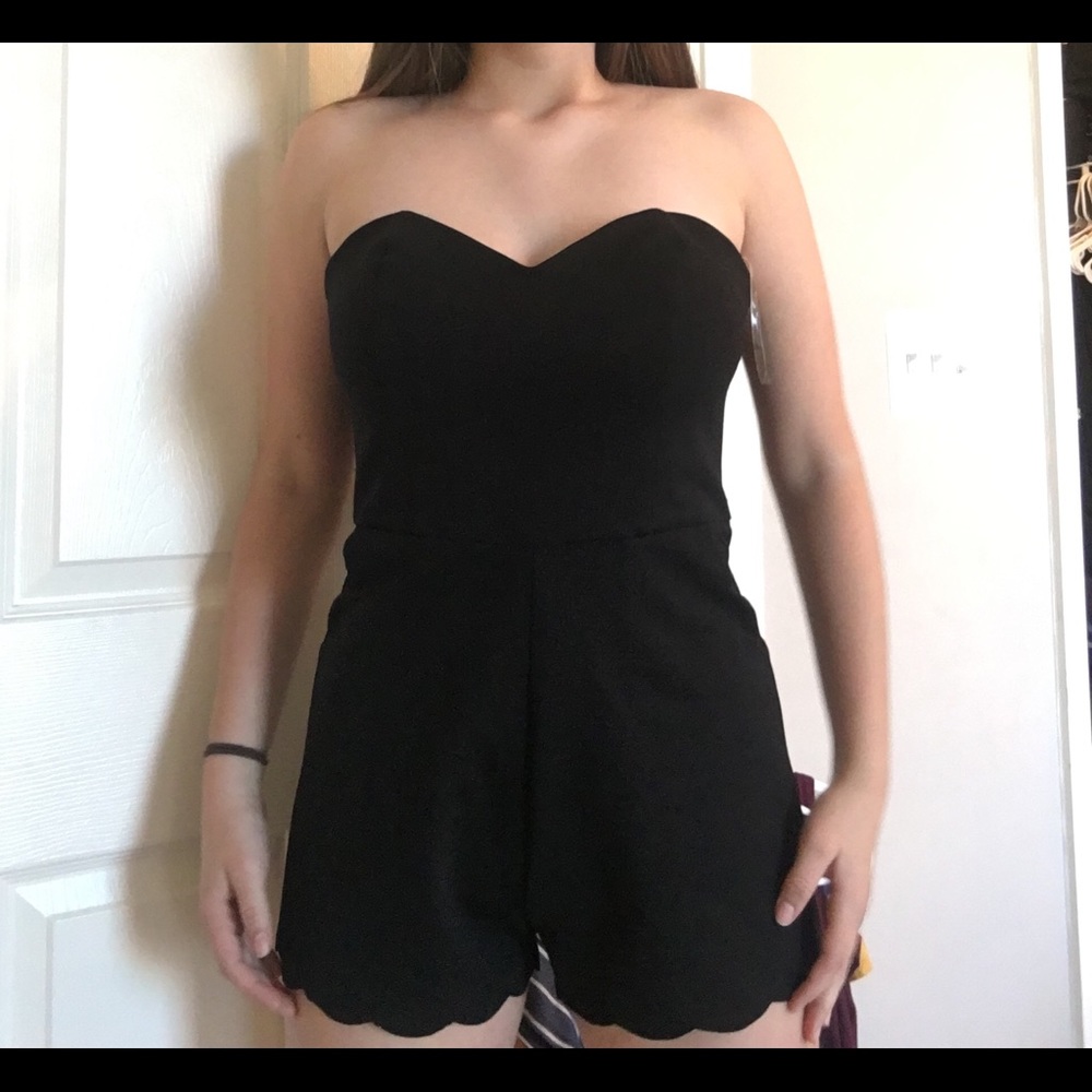 Black jumpsuit with scallop detail